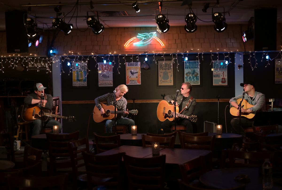 Singers and songwriters Brice Long, Marv Green, Terry McBride, and Luke Laird perform at the Bluebird Café in Nashville, 2020. (Jason Kempin/Getty Images)