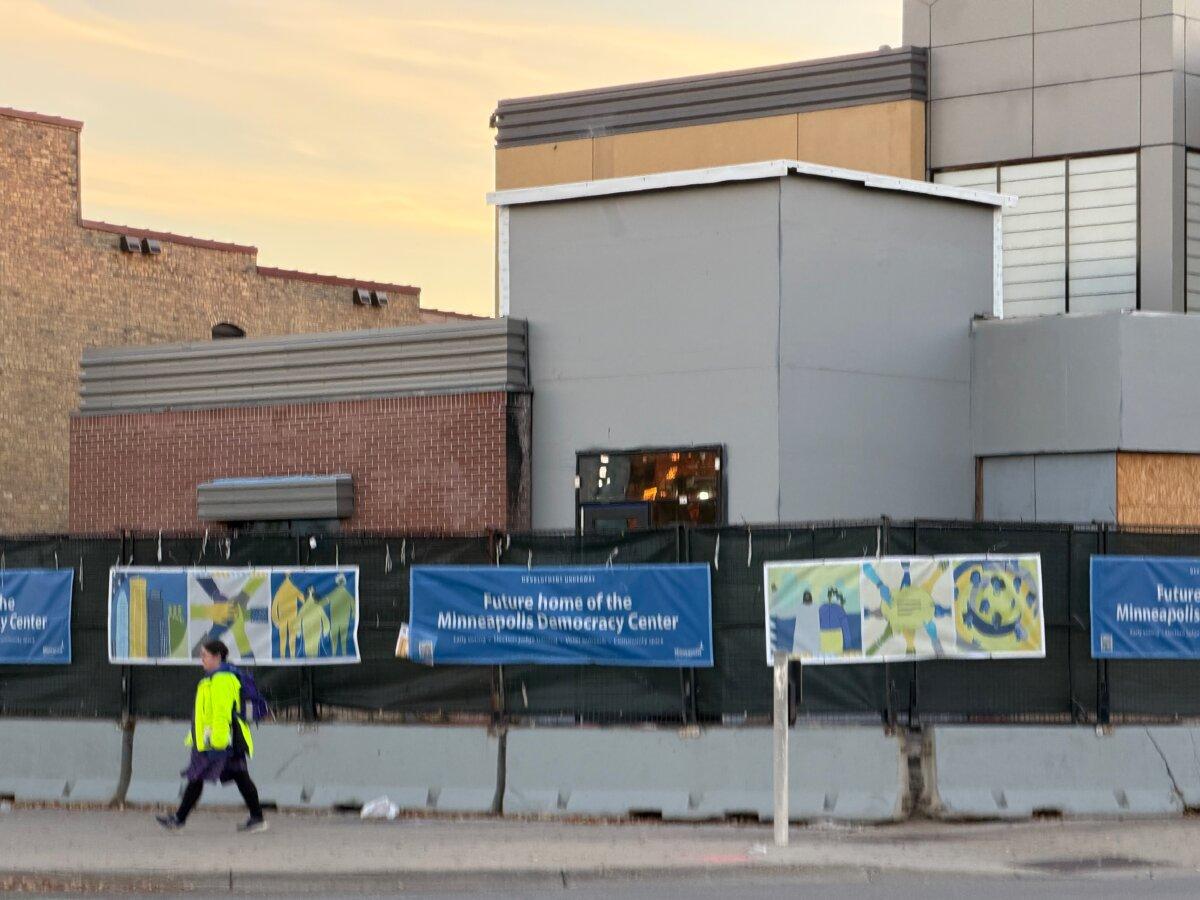 The former Third Precinct police headquarters, which rioters burned in 2020, remains boarded up awaiting redevelopment in Minneapolis on Nov. 3, 2025. (Janice Hisle/The Epoch Times)