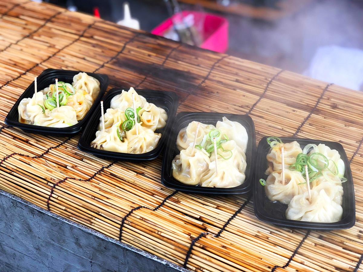 Mitarashi dango, skewered rice dumplings glazed with sweet soy sauce, are a common Kyoto street snack. (SAHACHATZ/Shutterstock)