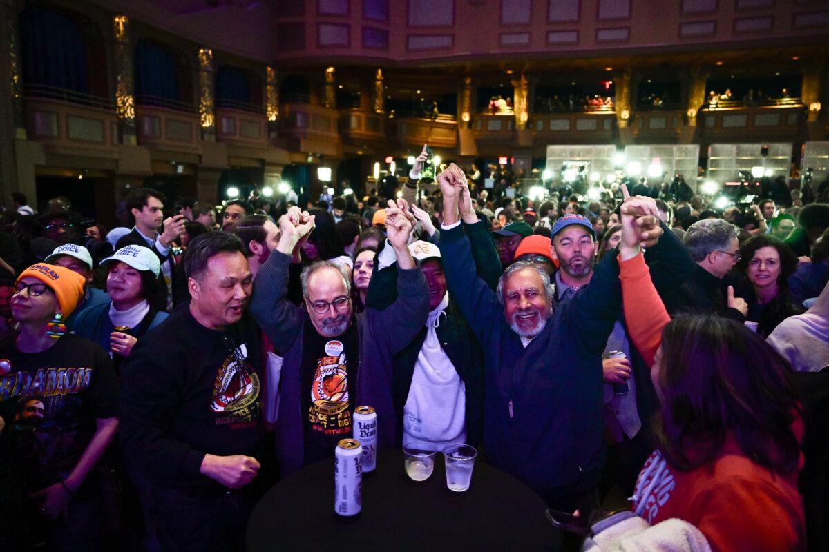 People attend the election party for New York City mayor-elect Zohran Mamdani at the Brooklyn Paramount Theater in the Brooklyn borough of New York City on Nov. 4, 2025. (Adhiraj Chakrabarti for The Epoch Times)