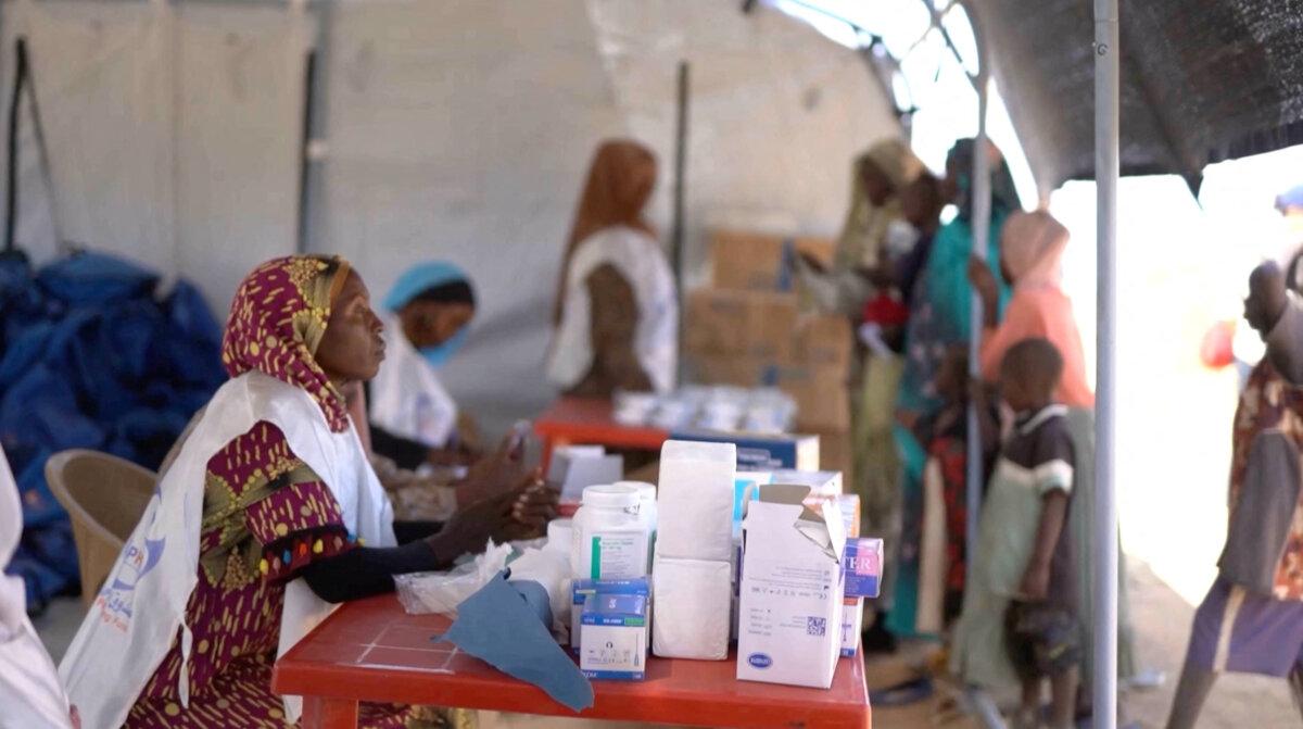 A medic waits in a makeshift clinic as displaced Sudanese gather after fleeing el-Fasher city in Darfur, in Tawila, Sudan, Oct. 29, 2025. (Mohamed Jamal/Reuters)