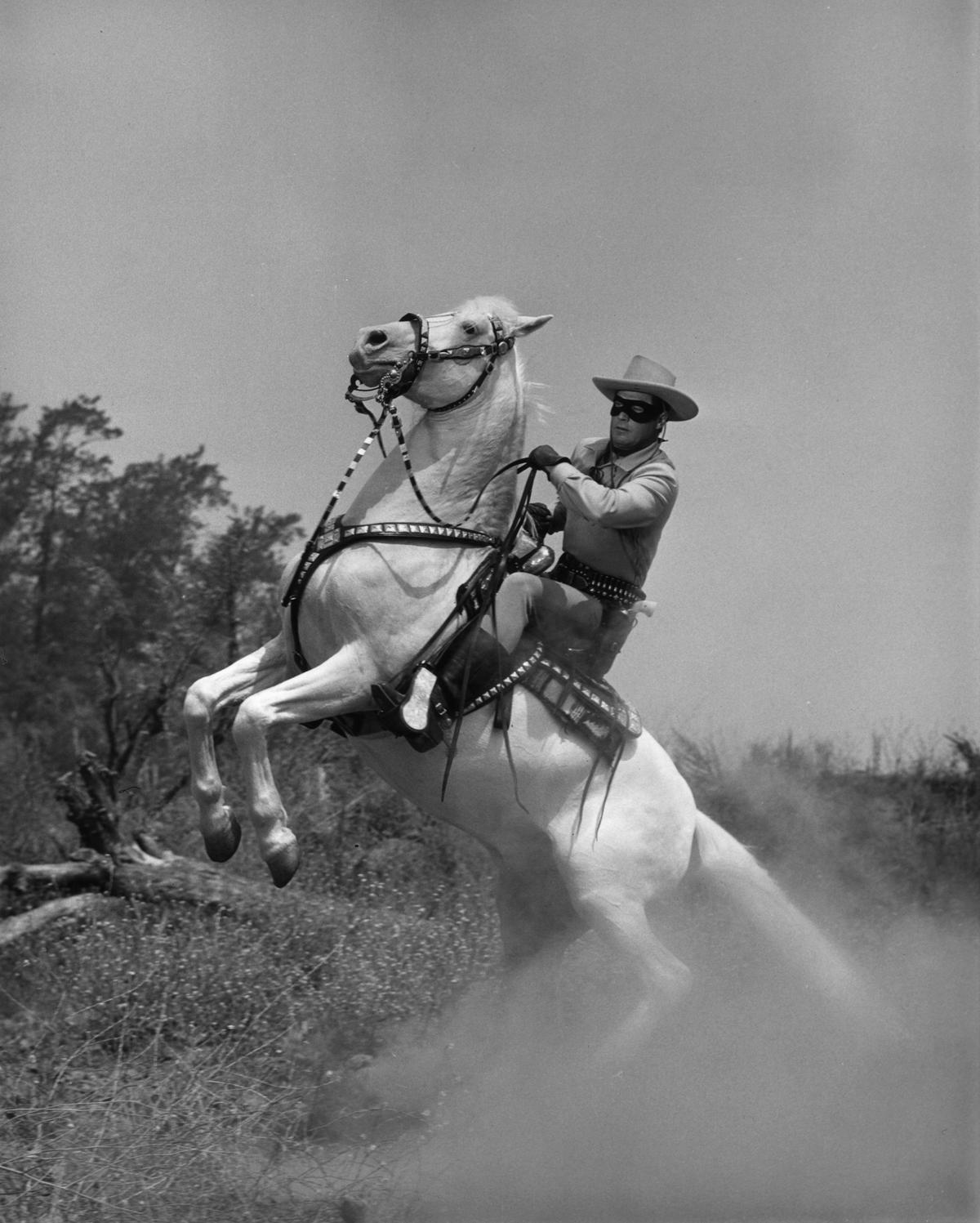 A film still from the American television series “The Lone Ranger” with actor Clayton Moore rearing his horse, Silver, circa 1955. (Hulton Archive/Getty Images)