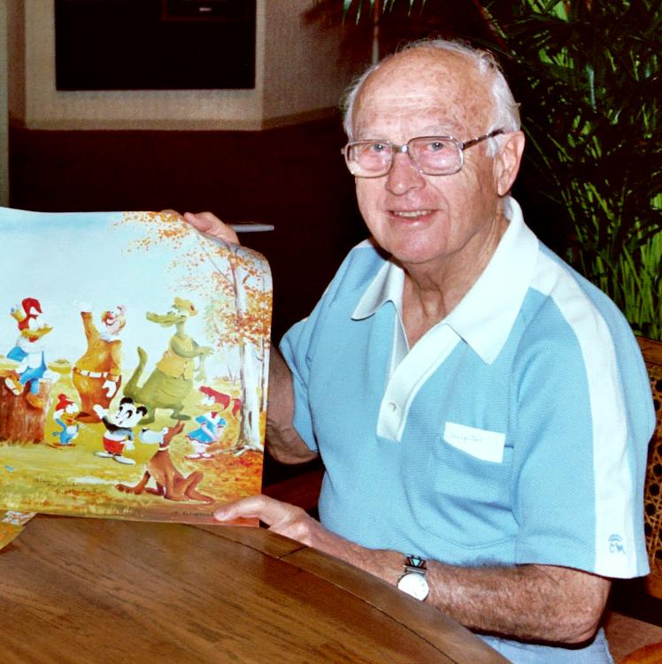 Lantz at an art store in Honolulu, 1983, displaying a painting of Wood Woodpecker. (Courtesy of Alan Light/<a href="https://en.wikipedia.org/wiki/Walter_Lantz#/media/File:Walter_Lantz_(1983).jpg">CC BY 2.0</a>)