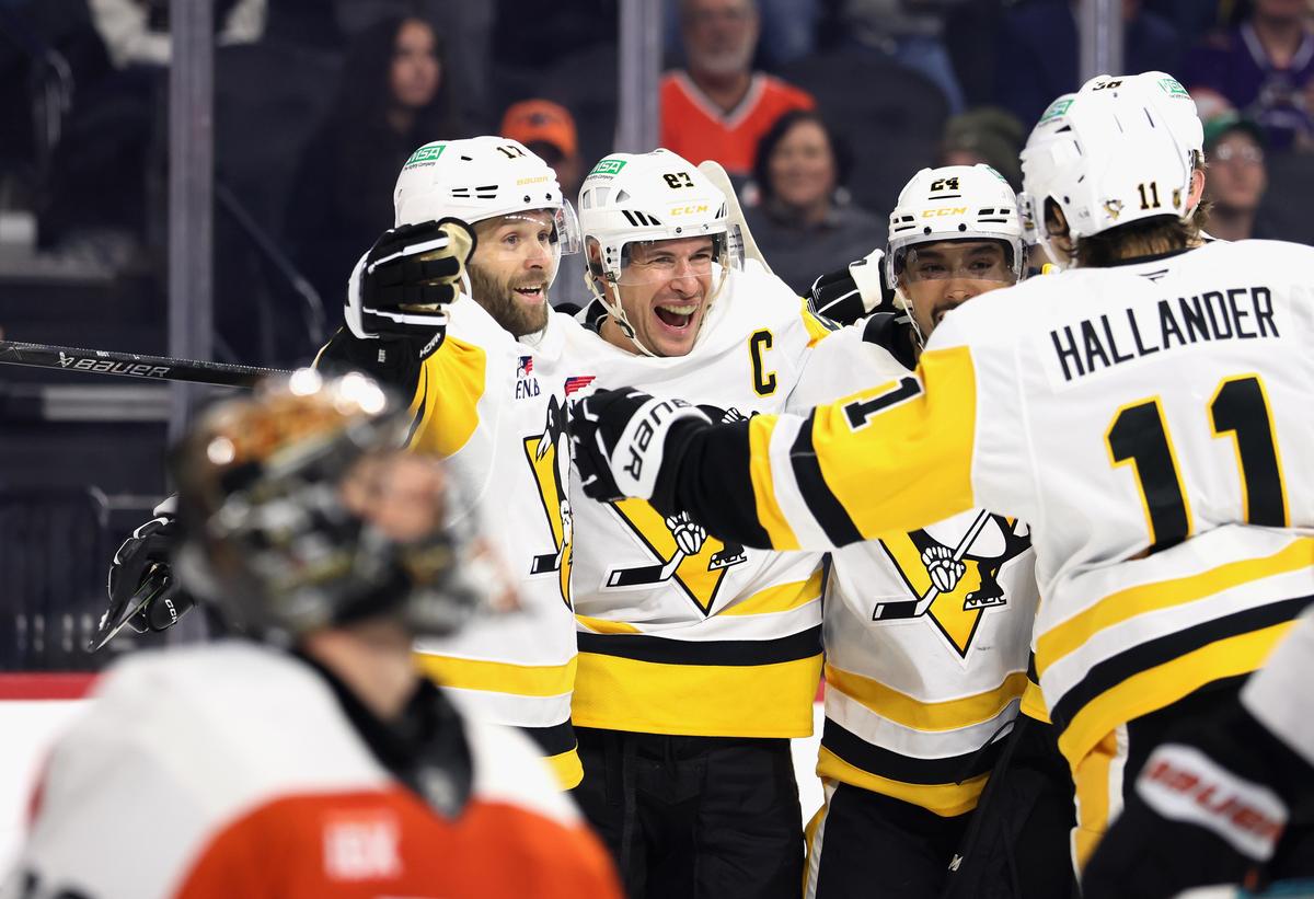 Sidney Crosby of the Pittsburgh Penguins (C) celebrates his third period goal against the Philadelphia Flyers at Xfinity Mobile Arena in Philadelphia, on Oct. 28, 2025. (Bruce Bennett/Getty Images)