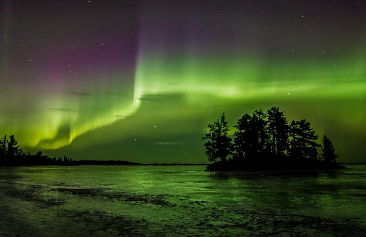 The Northern Lights dance in the night sky in Minnesota's Voyageurs National Park. (Martha Shuff)