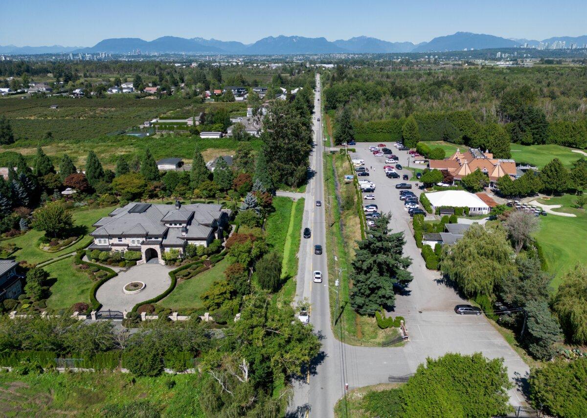 A residence (L), farmland, and a golf course that fall within the boundaries of a Cowichan Nation aboriginal title claim are seen along No. 6 Road in Richmond, B.C., on Aug. 22, 2025. (The Canadian Press/Darryl Dyck)