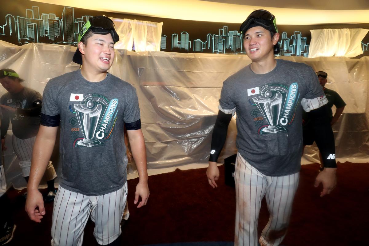 Munetaka Murakami #55 and Shohei Ohtani #16 of Team Japan celebrate in the clubhouse after defeating Team USA in the World Baseball Classic Championship 3-2 at LoanDepot park in Miami, Florida on March 21, 2023. (Alex Trautwig/Getty Images)