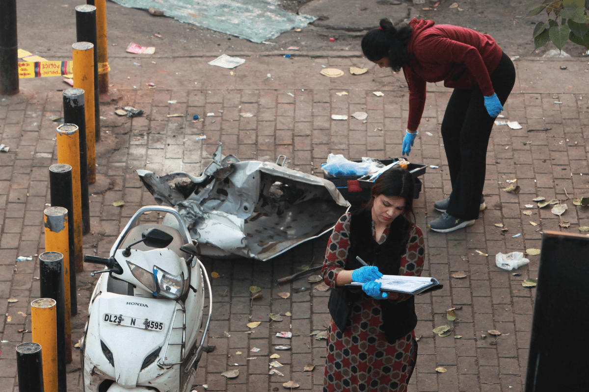 Investigators examine the site of Nov. 10's car explosion near the historic Red Fort, in New Delhi, India, on Nov. 11, 2025. (AP Photo)