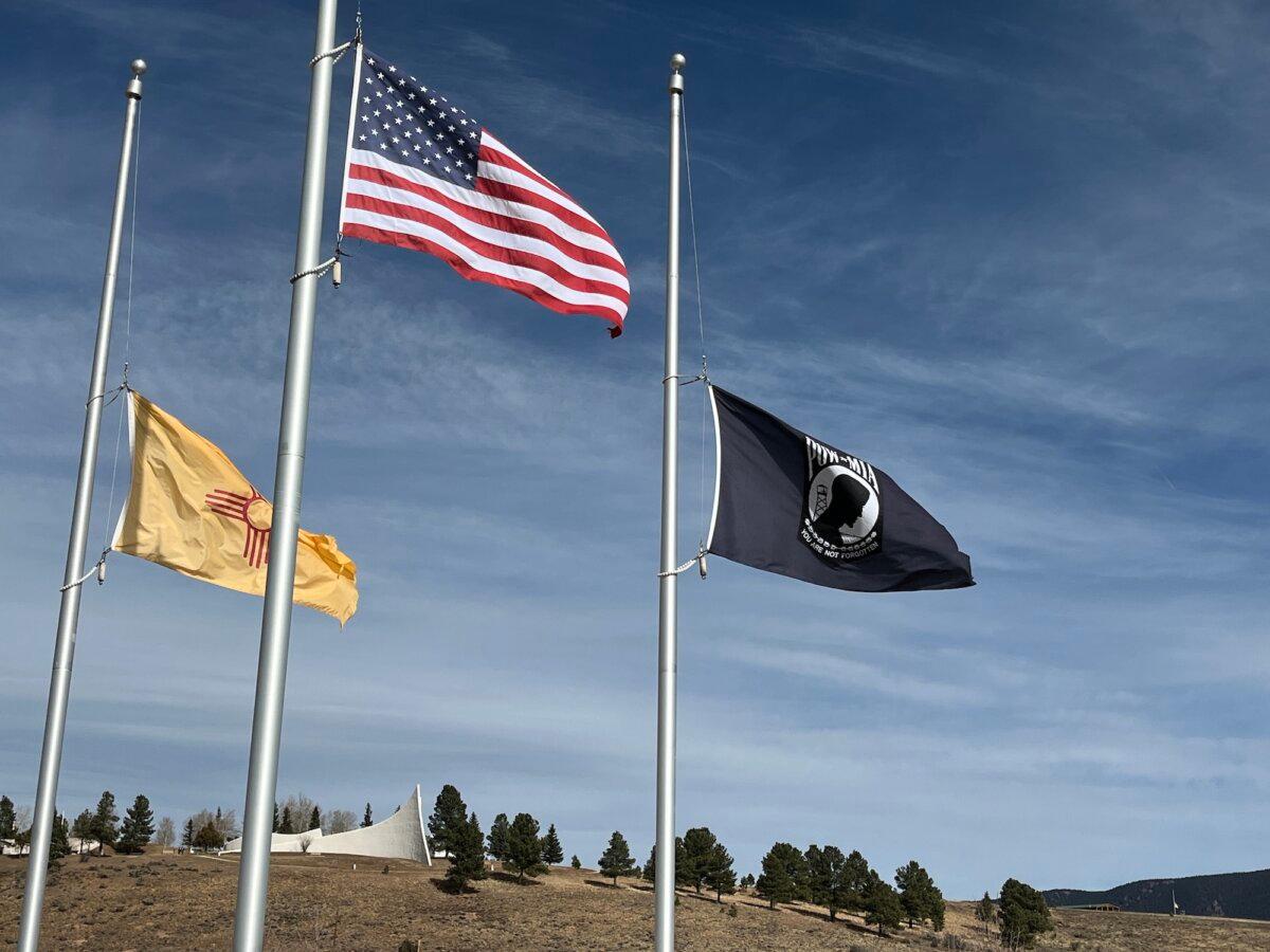 Flags stand at half mast at the Vietnam veterans cemetery in Angel Fire, N.M., on Nov. 11, 2025. (Allan Stein/The Epoch Times)