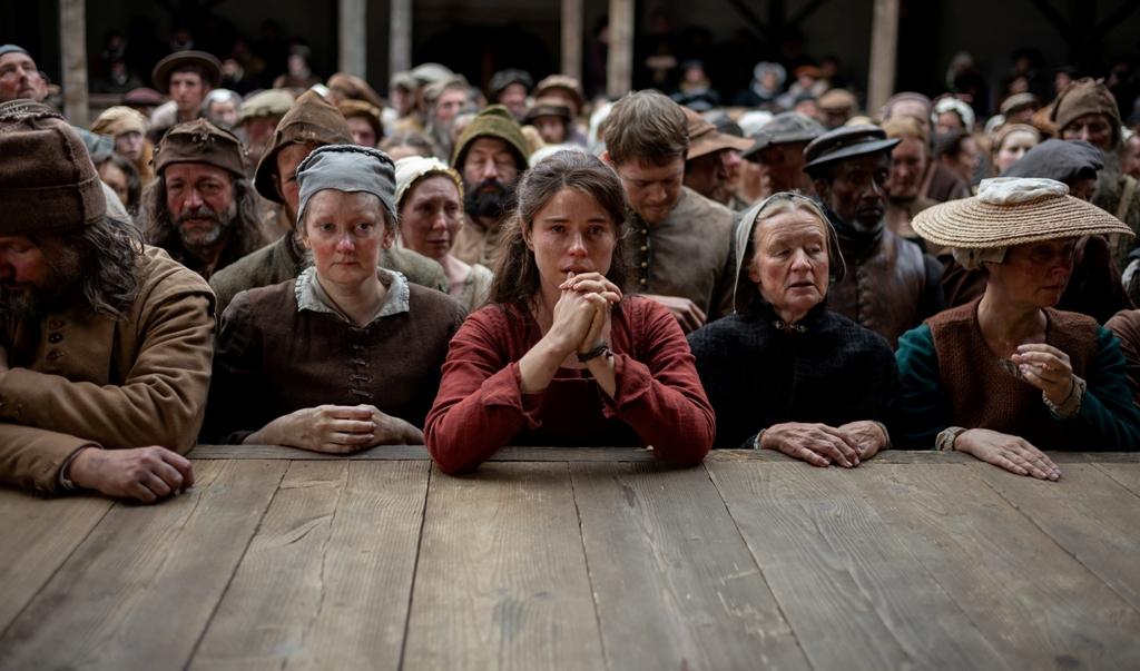 Agnes (Jessie Buckley, C) awaiting Shakespeare's play, in "Hamnet." (Agata Grzybowska/Focus Features/MovieStillsDB)