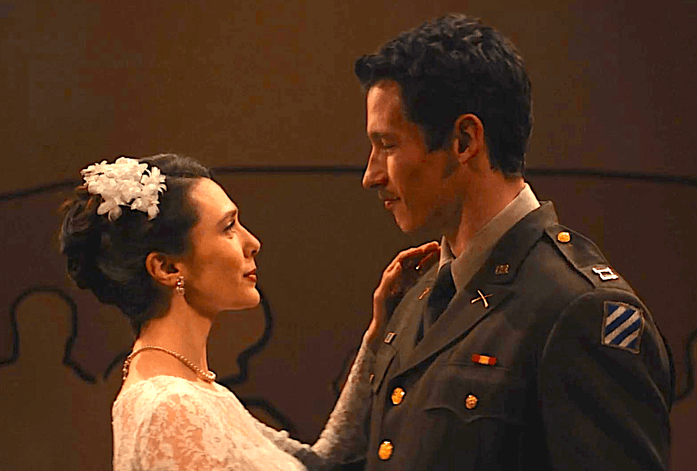 Elizabeth Olsen and Callum Turner as first-husband and wife in "Eternity." (Leah Gallo/A24)