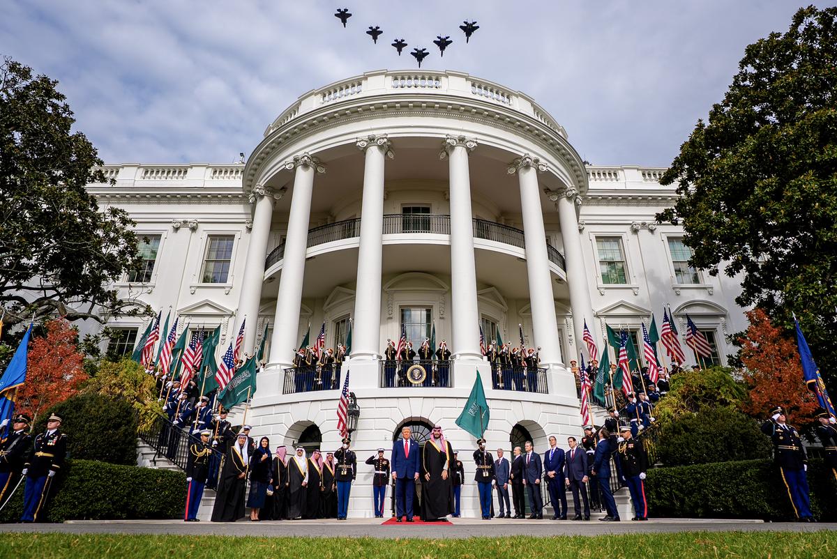 President Donald Trump stands with Crown Prince and Prime Minister Mohammed bin Salman of Saudi Arabia as F-35 and F-15 U.S. military jets perform a flyover during an arrival ceremony at the White House in Washington on Nov. 18, 2025. (Andrew Harnik/Getty Images)