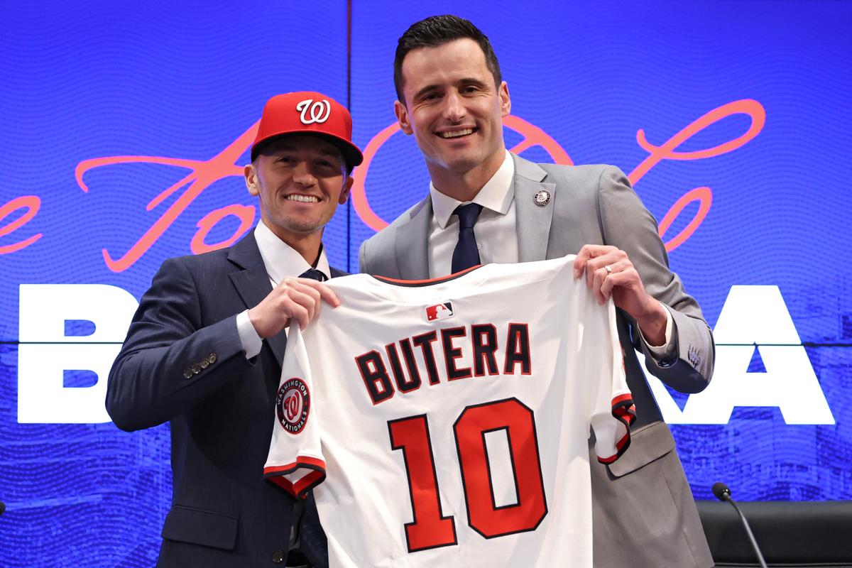 Washington Nationals President of Baseball Operations Paul Toboni (R) introduces Washington Nationals Manager Blake Butera (L) with his jersey during a press conference at Nationals Park in Washington, on Nov. 17, 2025. (Patrick Smith/Getty Images)