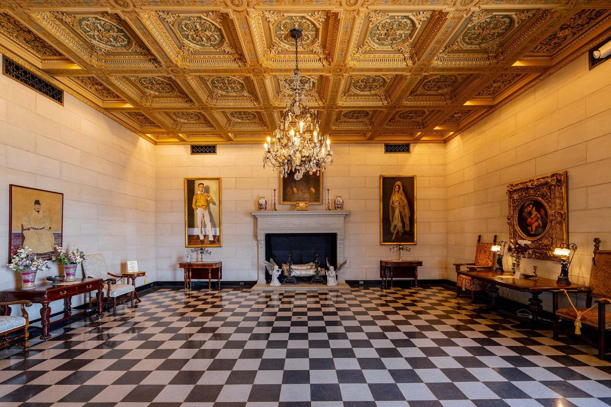 E.W. Marland’s second wife, Lydie, loved to dance. The mansion’s grand ballroom, with its gilded ceiling coffers and two enormous Waterford Crystal chandeliers, was where Lydie spent many evenings swaying to the music. Her portrait hangs to the right of the fireplace, where she is depicted wearing a Spanish gown and mantilla. Marland’s portrait hangs over the mantel, and a portrait of his adopted son, George, hangs to the left. (Kit Leong/Shutterstock)