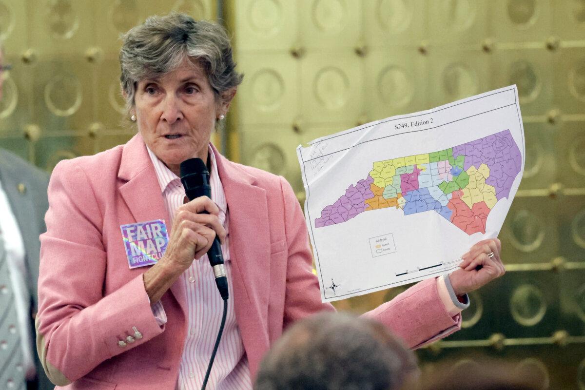 North Carolina state Rep. Pricey Harrison, a Democrat, holds an alternative map as she speaks on a redistricting bill at the legislative building in Raleigh, N.C., on Oct. 22, 2025. (Chris Seward/AP Photo)