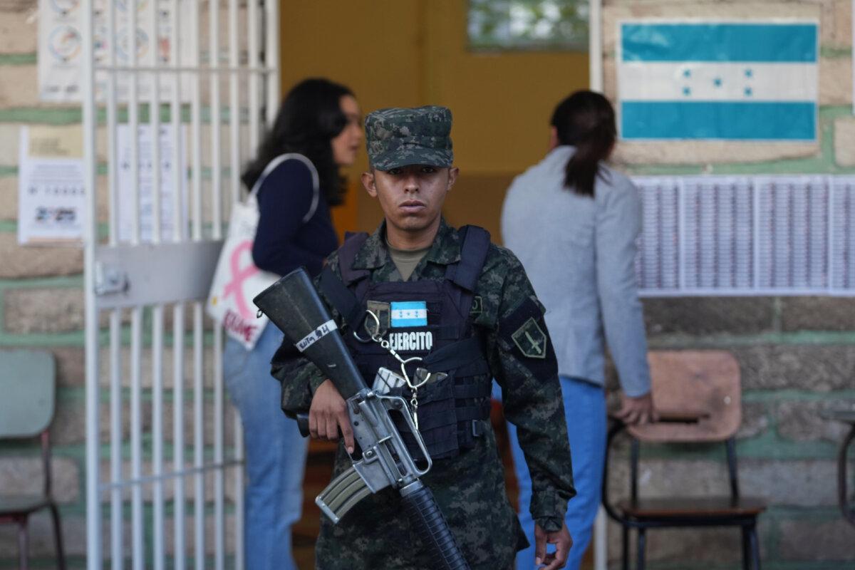 A soldier guards a polling station during general elections in Tegucigalpa, Honduras, on Nov. 30, 2025. (Moises Castillo/AP Photo)