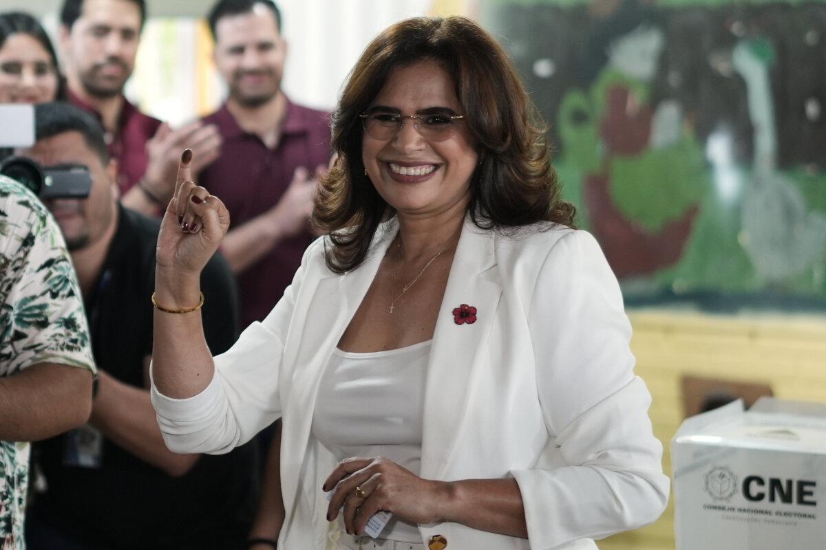 Rixi Moncada, presidential candidate of the ruling Liberty and Refoundation party, shows her inked finger after voting in the general election in Tegucigalpa, Honduras, on Nov. 30, 2025. (Emmanuel Andres/AP Photo)