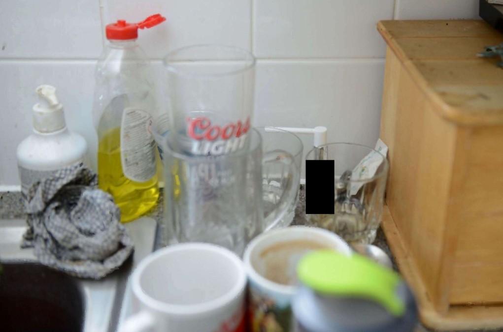 An undated image showing the perfume bottle (behind the black rectangle) containing Novichok, which was found at Charlie Rowley's home in Amesbury, England, after his girlfriend Dawn Sturgess died on July 8, 2018. (Metropolitan Police/Dawn Sturgess Inquiry)