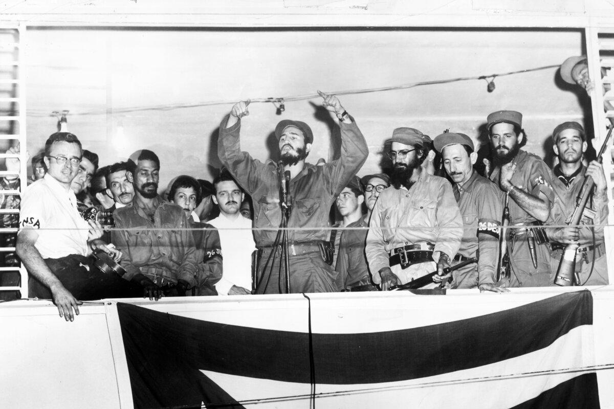 Fidel Castro addresses a crowd from a podium in Camaguey, Cuba, on Jan. 4, 1959. (Hulton Archive/Getty Images)