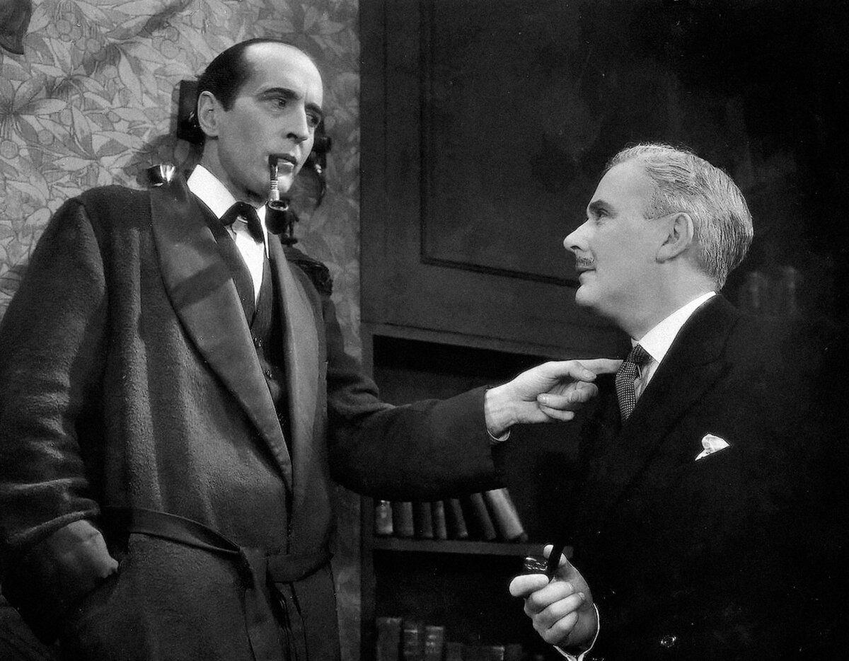 Sherlock Holmes (Arthur Wontner, L) and Dr. Watson (Ian Fleming), in “Sherlock Holmes' Fatal Hour.” (GJW+)