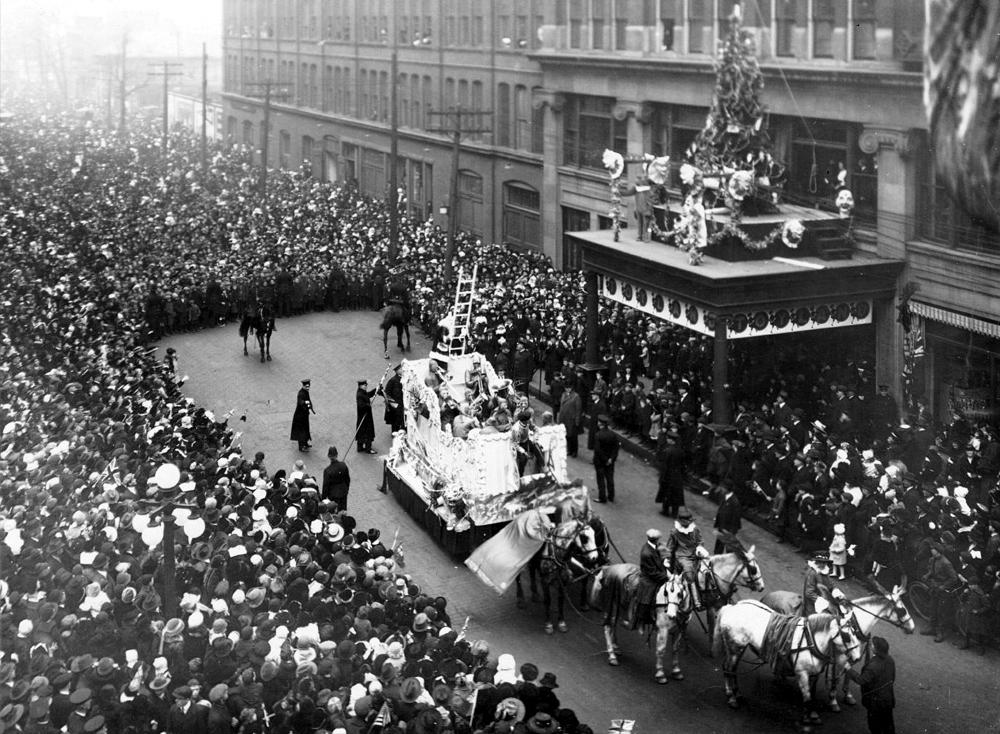 The Eaton's Santa Claus Parade on James Street in Toronto in 1918. At the end of the parade, Santa would climb from his float up a ladder into the Eaton's department store. (Public Domain)