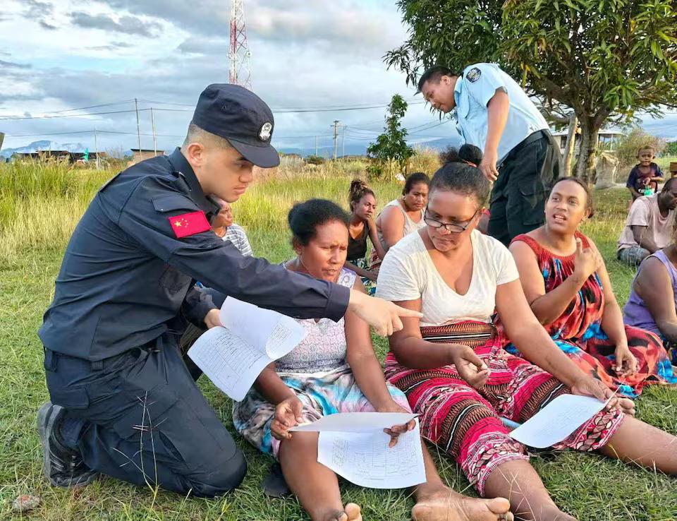 Members of the Royal Solomon Islands Police Force and China Police Liaisons interact with local members of the Fighter One community, in Honiara, Solomon Islands, in this undated handout image released on Sept. 3, 2025. (Courtesy of Royal Solomon Islands Police Force)