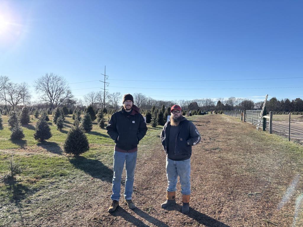Co-owners Kyle Anderson (L) and Kevin Mullenix said that Advent Christmas Tree Farm has a few thousand trees growing at different stages of maturity on Dec. 8, 2025. (Jeff Louderback/The Epoch Times)