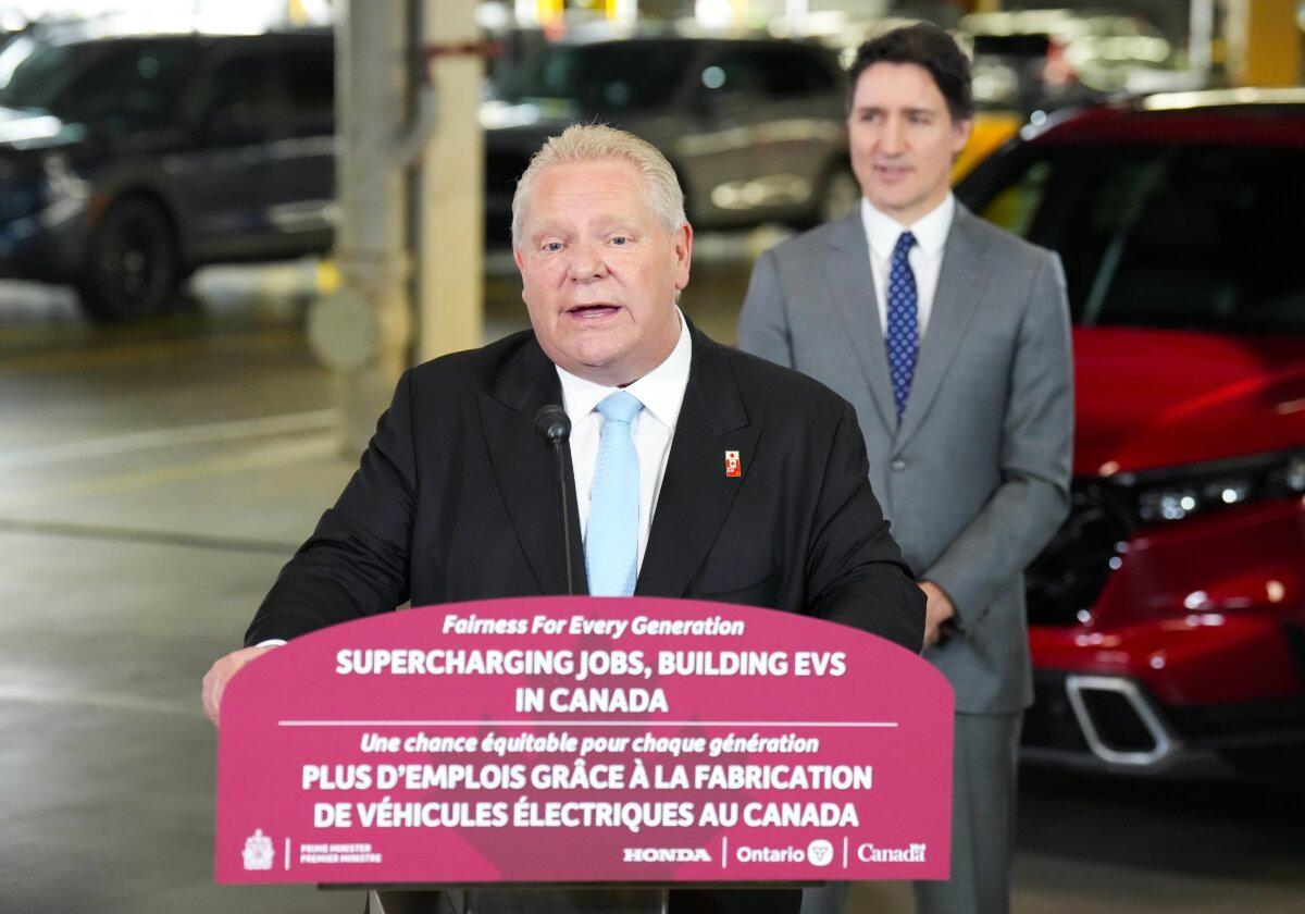 Ontario Premier Doug Ford speaks as then-Prime Minister Justin Trudeau listens at an event announcing plans for a Honda electric vehicle battery plant in Alliston, Ont., on April 25, 2024. (The Canadian Press/Nathan Denette)