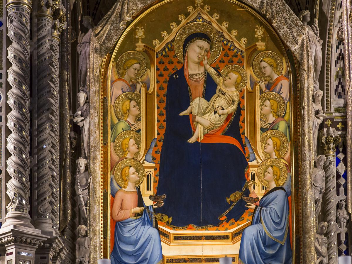 Bernardo Daddi’s “Madonna and Child” (“Madonna delle Grazie”) replaced the faded fresco of the Virgin in 1347. Daddi’s painting showcases proto-Renaissance naturalism depicted in the interactions of the Virgin and Child. Circling the portrait are Orcagna’s sculpted angels, who pull back a marble curtain, or veil, and are bordered by twisted columns. (Isogood_patrick/Shutterstock)