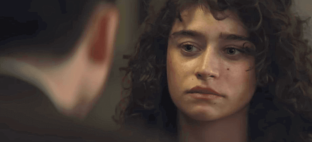 Marty Mauser (Timothée Chalamet) explaining to Rachel Mizler (Odessa A'zion) why he can't be responsible for getting her pregnant, in "Marty Supreme." (A24)