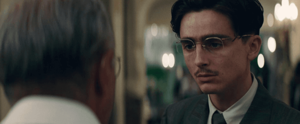 Milton Rockwell (Kevin O'Leary, L) explaining to Marty Mauser (Timothée Chalamet), why he refuses to financially back Marty's ping pong career in "Marty Supreme." (A24)