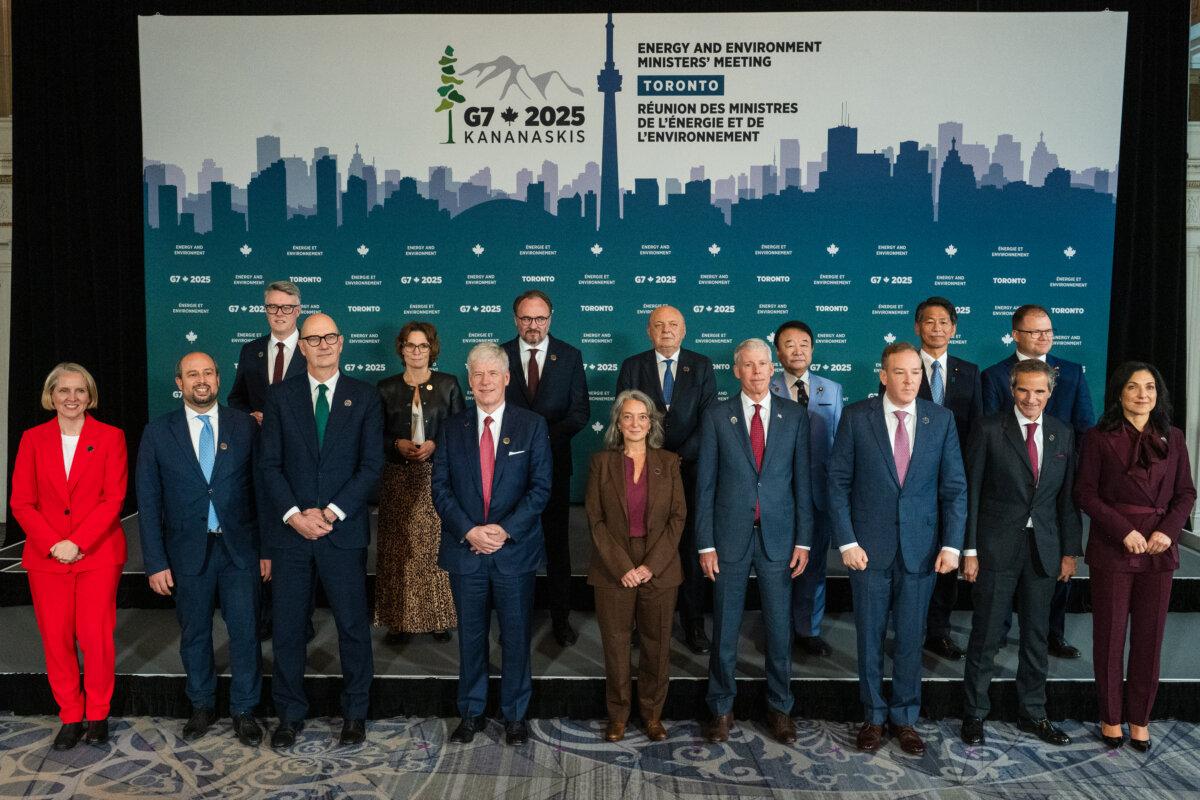Minister of the Environment Climate Change Julie Dabrusin (front, 5-L) and Minister of Energy Tim Hodgson (front, 4-L) and other G7 ministers pose for a group photo at the G7 Energy and Environment Ministers' Meeting in Toronto, on Oct. 30, 2025. (The Canadian Press/Laura Proctor)