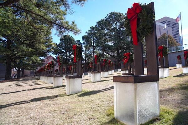 Empty bronze chairs decorated in holiday ribbons and wreaths represent each of the 168 people who died during the bombing of the federal building in Oklahoma City, Okla., on April 19, 2025. (Allan Stein/The Epoch Times)