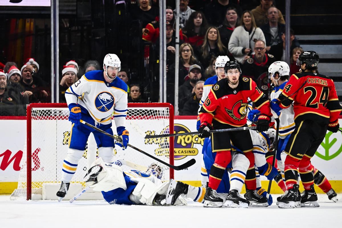 Goaltender Alex Lyon (34) of the Buffalo Sabres covers the puck during the third period against the Ottawa Senators at Canadian Tire Centre in Ottawa, Ontario, Canada on December 23, 2025. (Minas Panagiotakis/Getty Images)