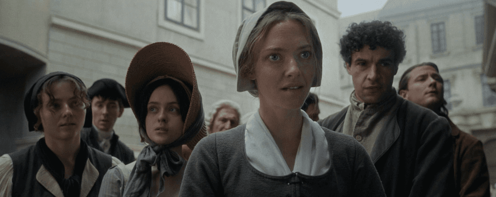 Ann Lee (Amanda Seyfried, center) fervently instructs naysayers of Shakerism, in "The Testament of Ann Lee." (Annapurna Pictures)