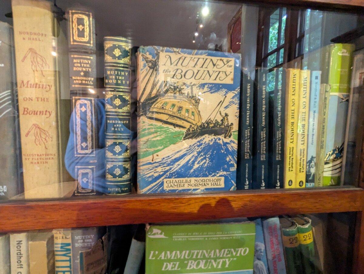 A bookcase at the James Norman Hall Museum in Tahiti displays Hall's personal copies of "Mutiny on the Bounty" and other books he coauthored with Charles Nordhoff. (Athena Lucero0)
