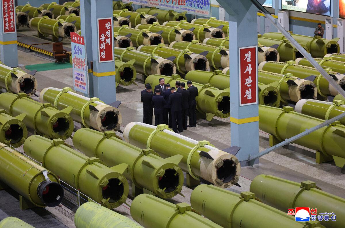 In a photo provided by the North Korean regime, North Korean leader Kim Jong Un inspects missile and shell production at a factory in an undisclosed location in North Korea, on Dec. 26, 2025. (Korean Central News Agency/Korea News Service via AP)