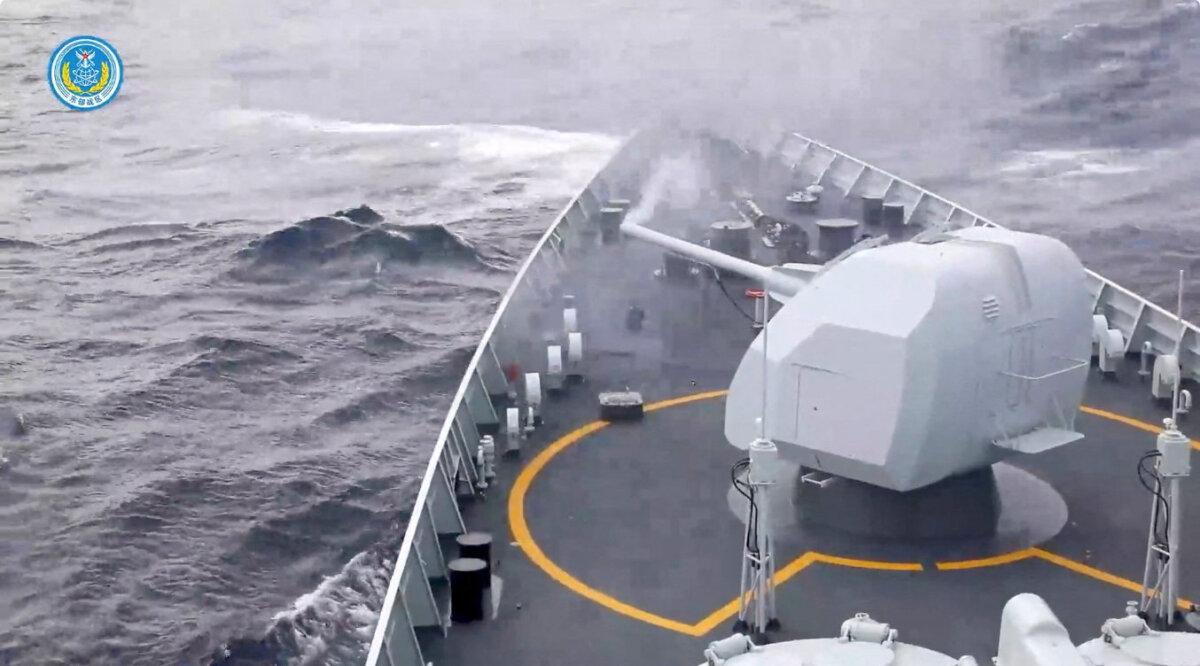 Smoke rises from a weapon on a ship after it was fired during drills east of Taiwan, in this screenshot from a video released by the Eastern Theatre Command of China's People's Liberation Army on Dec. 29, 2025. (Eastern Theatre Command/Handout via Reuters)