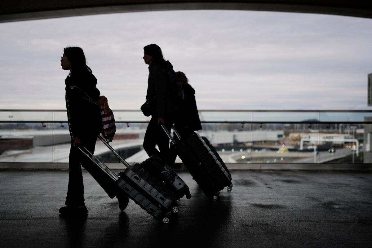 Travelers make their way through the Nashville International Airport on Nov. 25, 2025. (George Walker IV/AP Photo)