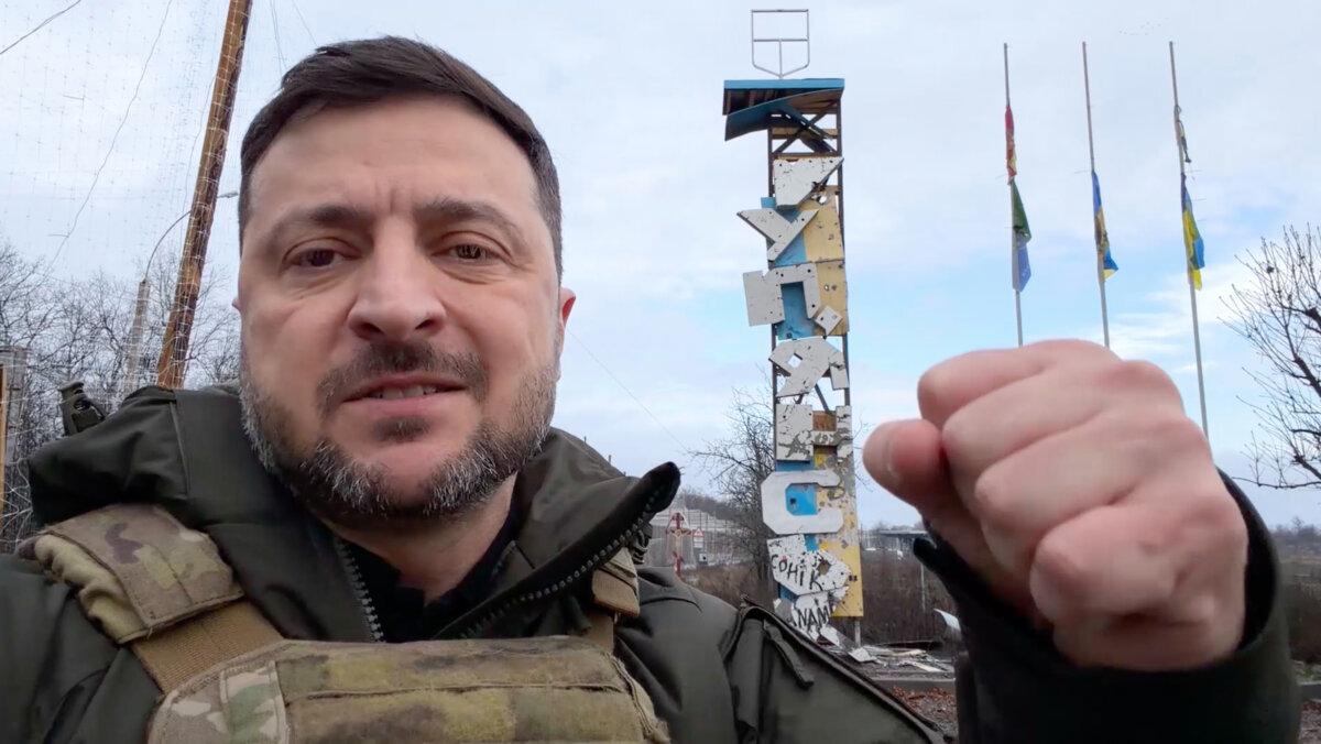 Ukrainian President Volodymyr Zelenskyy records a video at the entrance of Kupiansk, Ukraine, on Dec. 12, 2025. (Press Service Of The President Of Ukraine via AP)