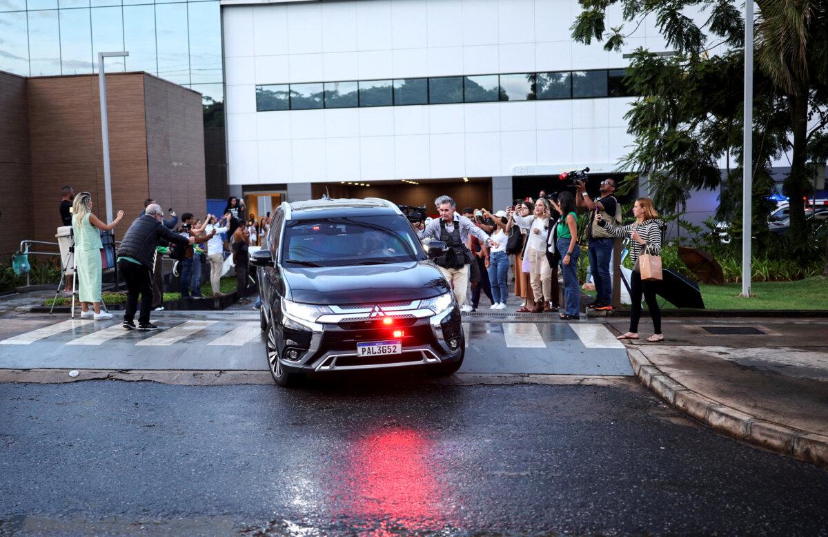 The motorcade of former Brazilian President Jair Bolsonaro leaves the hospital after he underwent surgeries for bilateral inguinal hernia repair and to treat persistent hiccups, while serving a 27-year sentence for plotting a coup, in Brasília, Brazil, on Jan. 1, 2026. (Mateus Bonomi/Reuters)