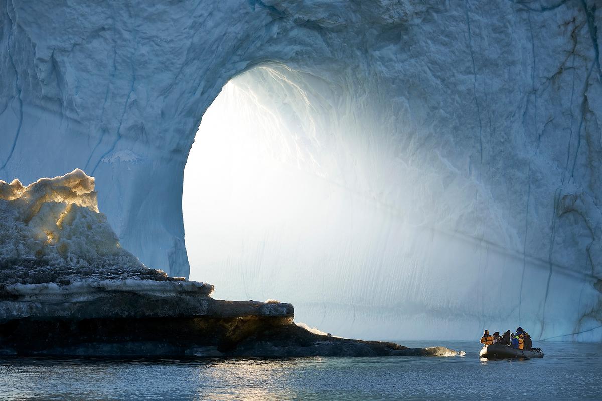 Greenland's Scoresby Sund, the world's largest fjord system, holds incredible ice formations that dwarf ships and leave travelers in awe. (Arctic-Images/Getty Images)
