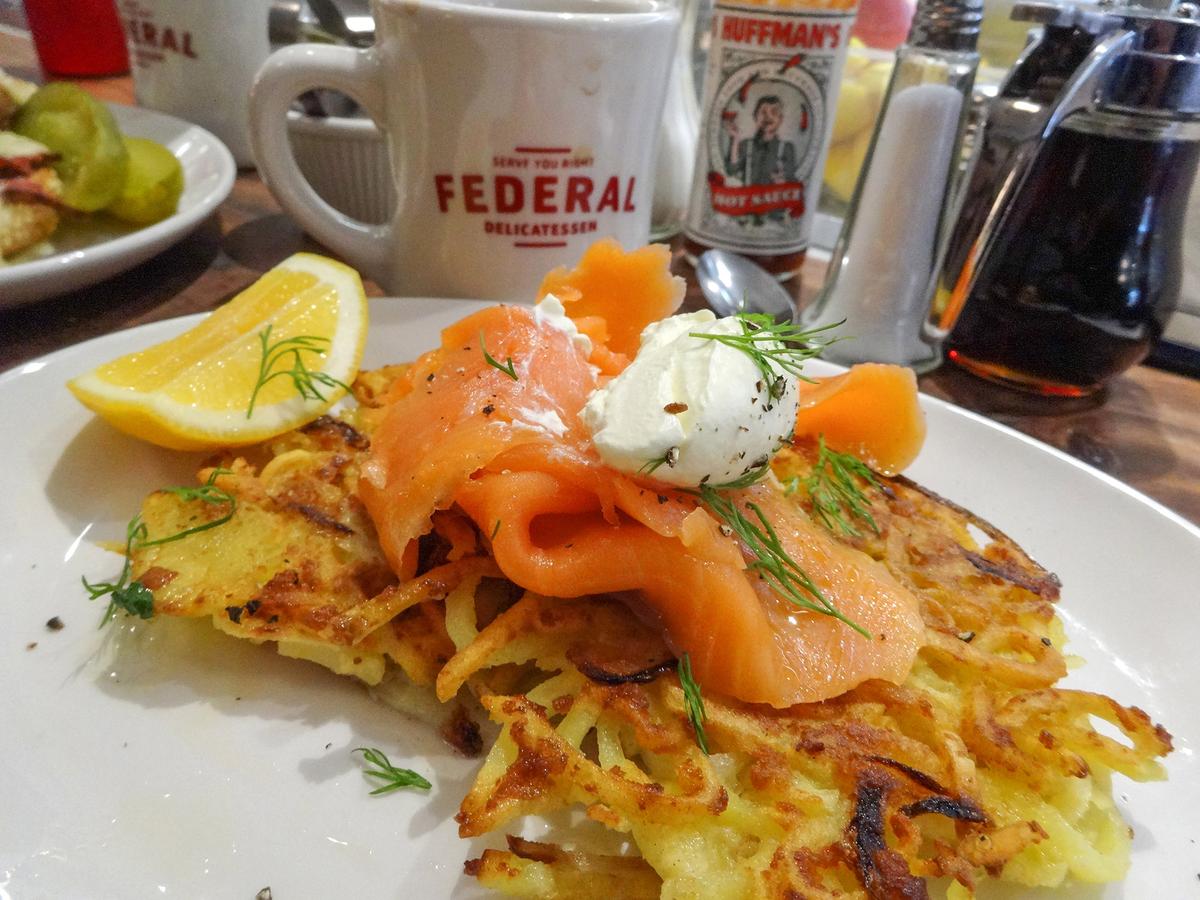 Salmon latkes are commonly pan-fried and served with accompaniments such as creme fraiche and dill. (cktravels.com/Shutterstock)