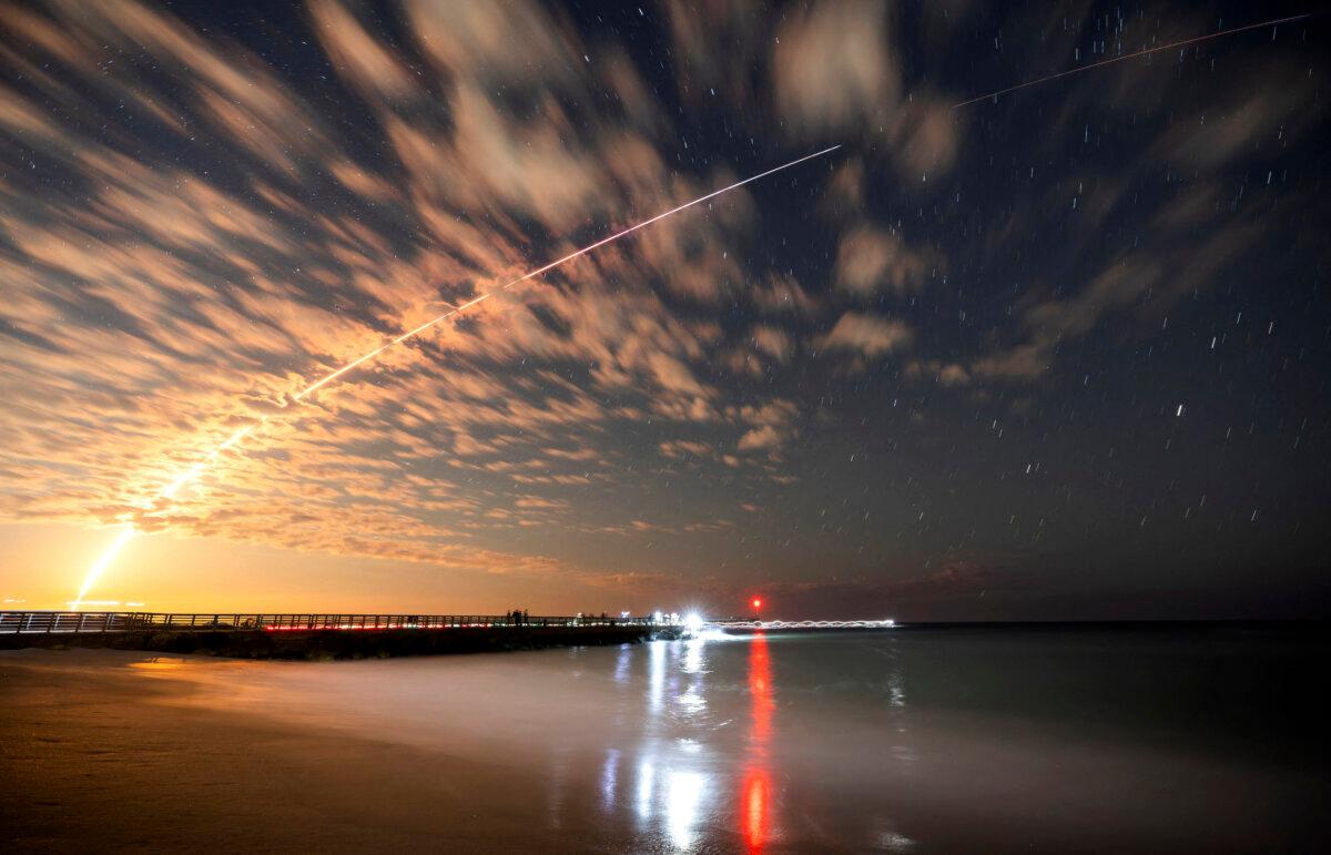 The SpaceX Falcon 9 rocket carrying Starlink satellites is seen over Sebastian Inlet after launching from Cape Canaveral, Fla., on Feb. 26, 2025. (Sam Wolfe/Reuters)