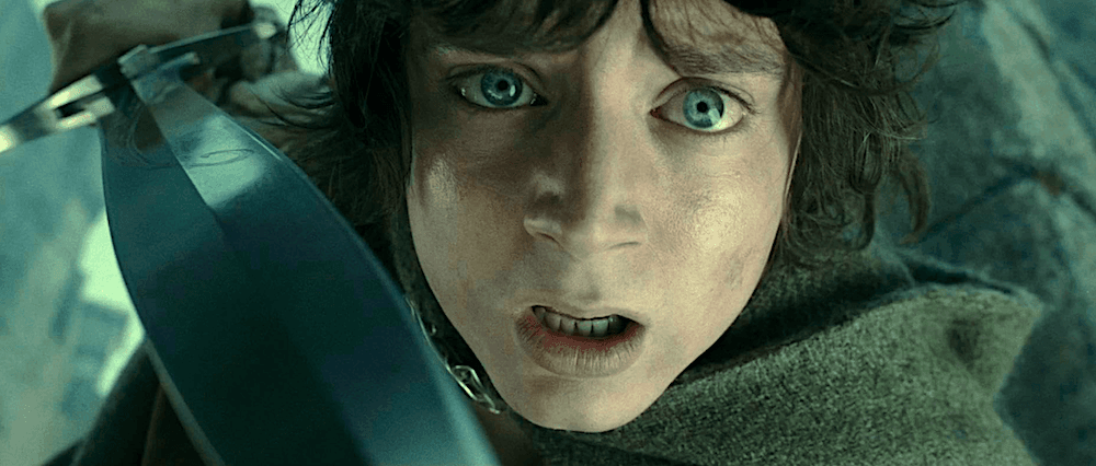 Frodo Baggins (Elijah Wood), who's become paranoid because the One Ring is affecting his mind, threatens his friend Samwise, in "The Lord of the Rings: The Two Towers." (New Line Cinema)