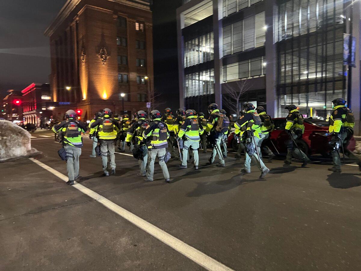 Multiple agencies responded to downtown Minneapolis on Jan. 9 after rowdy demonstrators attempted to break into hotels they suspected ICE agents were staying at. (Jacki Thrapp/The Epoch Times)
