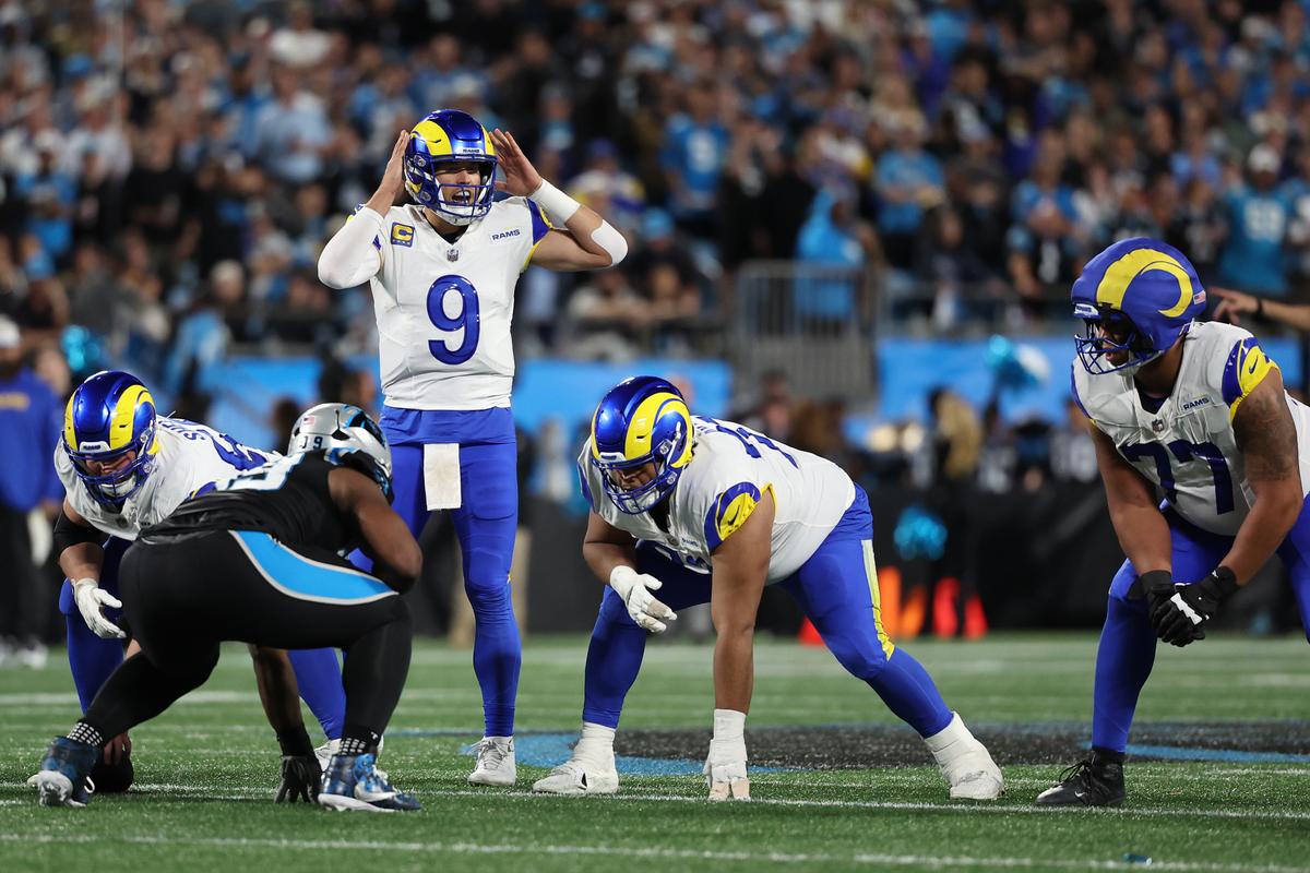 Matthew Stafford (9) of the Los Angeles Rams calls a play against the Carolina Panthers during the fourth quarter in the NFC Wild Card Playoff game at Bank of America Stadium in Charlotte, North Carolina, on Jan. 10, 2026. (David Jensen/Getty Images)