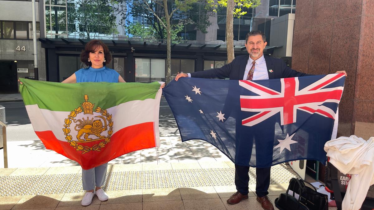 Maani Taghizadeh (R) and wife, Minoo Toussi, heads of the Iranian Australian Patriots Association during a demonstration outside the U.S. Consulate in Sydney, Australia, on Jan. 13, 2026. (Adam Chiang/The Epoch Times)