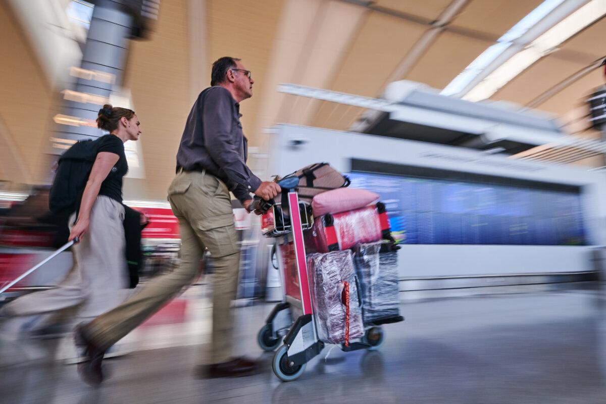 Travellers at the Pearson International Airport in Toronto on Aug. 16, 2025. (The Canadian Press/Sammy Kogan)