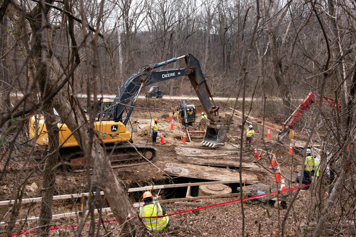 Crews work to keep raw sewage from flowing into the Potomac River after a pipeline rupture, in Glen Echo, Md., on Jan. 23, 2026. (Cliff Owen/AP Photo)